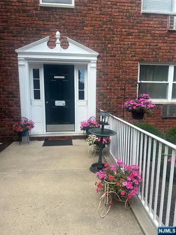 a view of a brick house with an outdoor seating