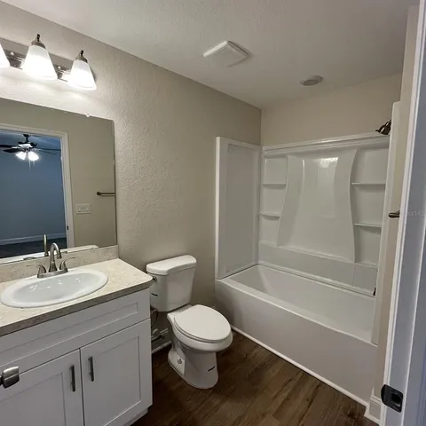 a bathroom with a toilet a sink and a bathtub