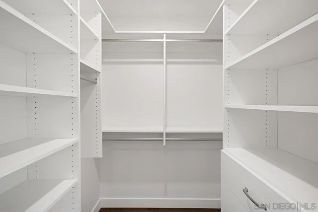 a view of an empty walk in closet