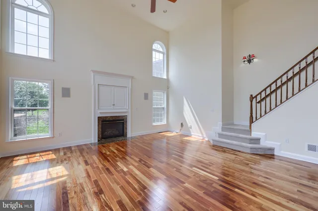 a kitchen with stainless steel appliances granite countertop a refrigerator and a stove