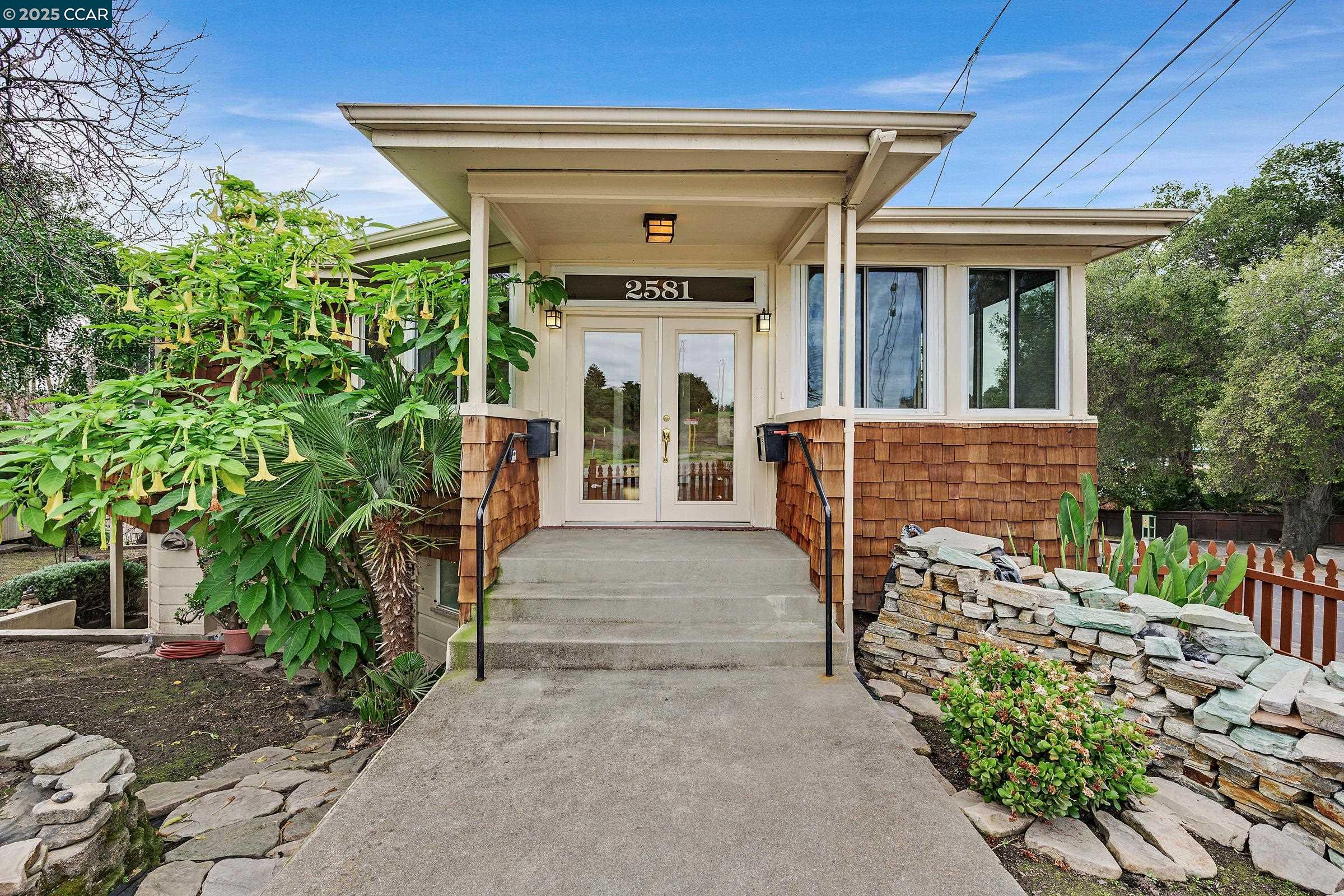 2581 Charles Avenue Pinole, CA 94564 - Photo 3 of 50 a front view of a house with a porch