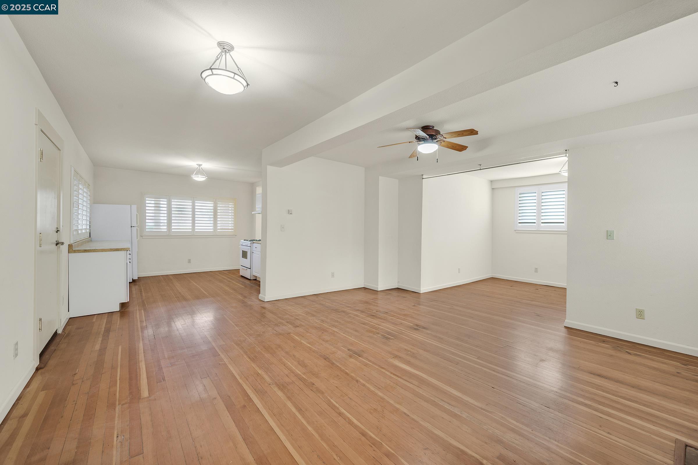 2581 Charles Avenue Pinole, CA 94564 - Photo 32 of 50 a view of an empty room with wooden floor and a window