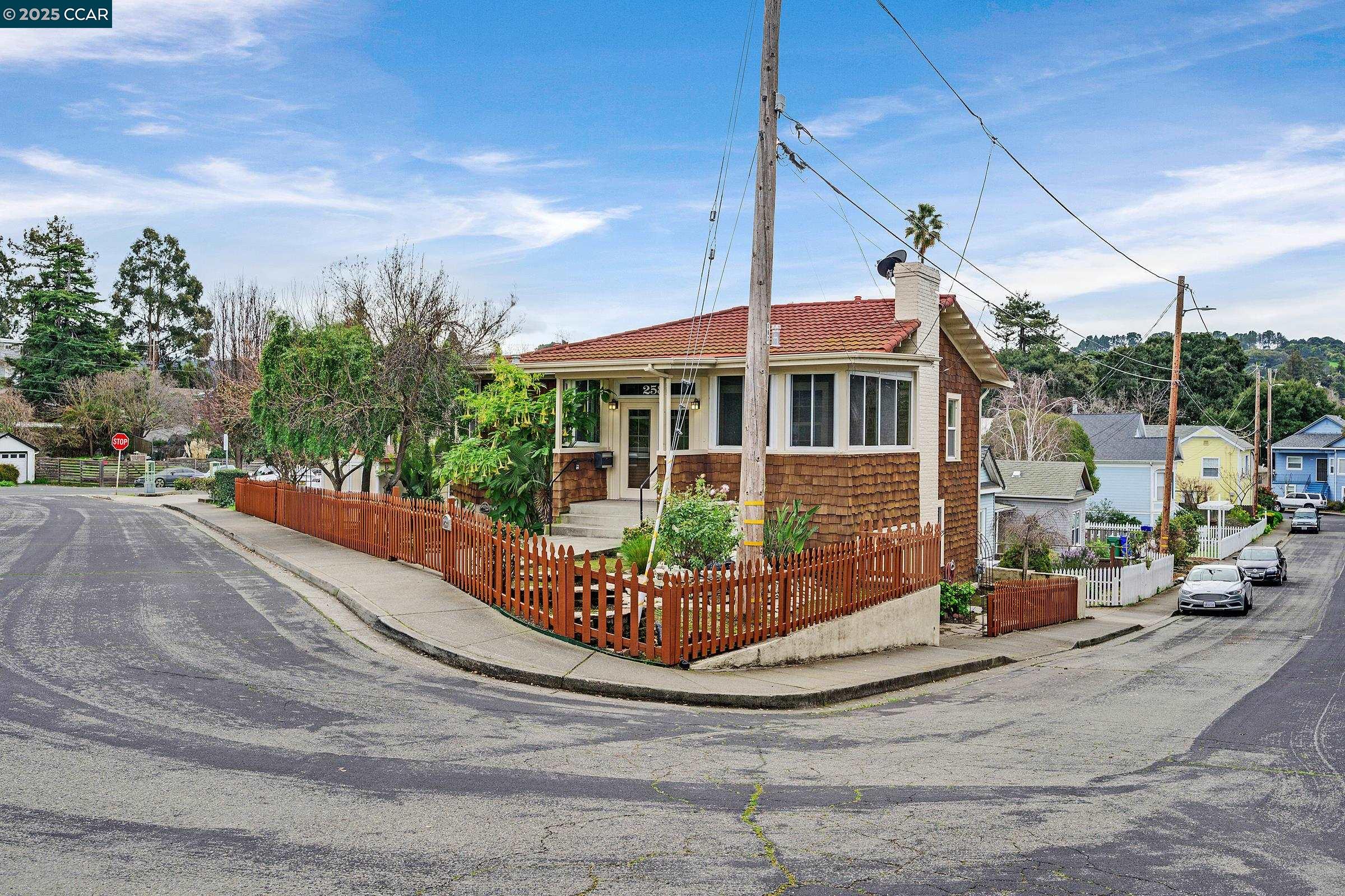 2581 Charles Avenue Pinole, CA 94564 - Photo 38 of 50 a front view of a house with a garden and mountain view