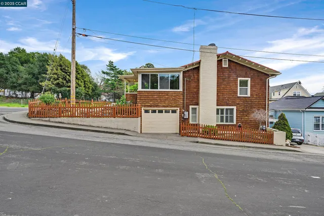 a view of a house with a street