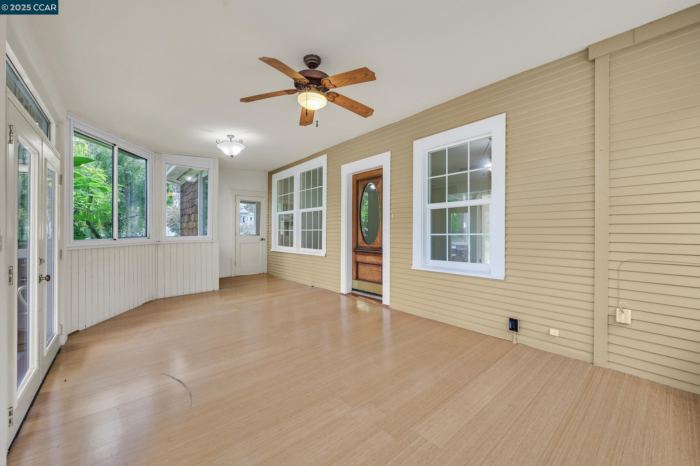 2581 Charles Avenue Pinole, CA 94564 - Photo 5 of 50 a view of an empty room with a window and wooden floor