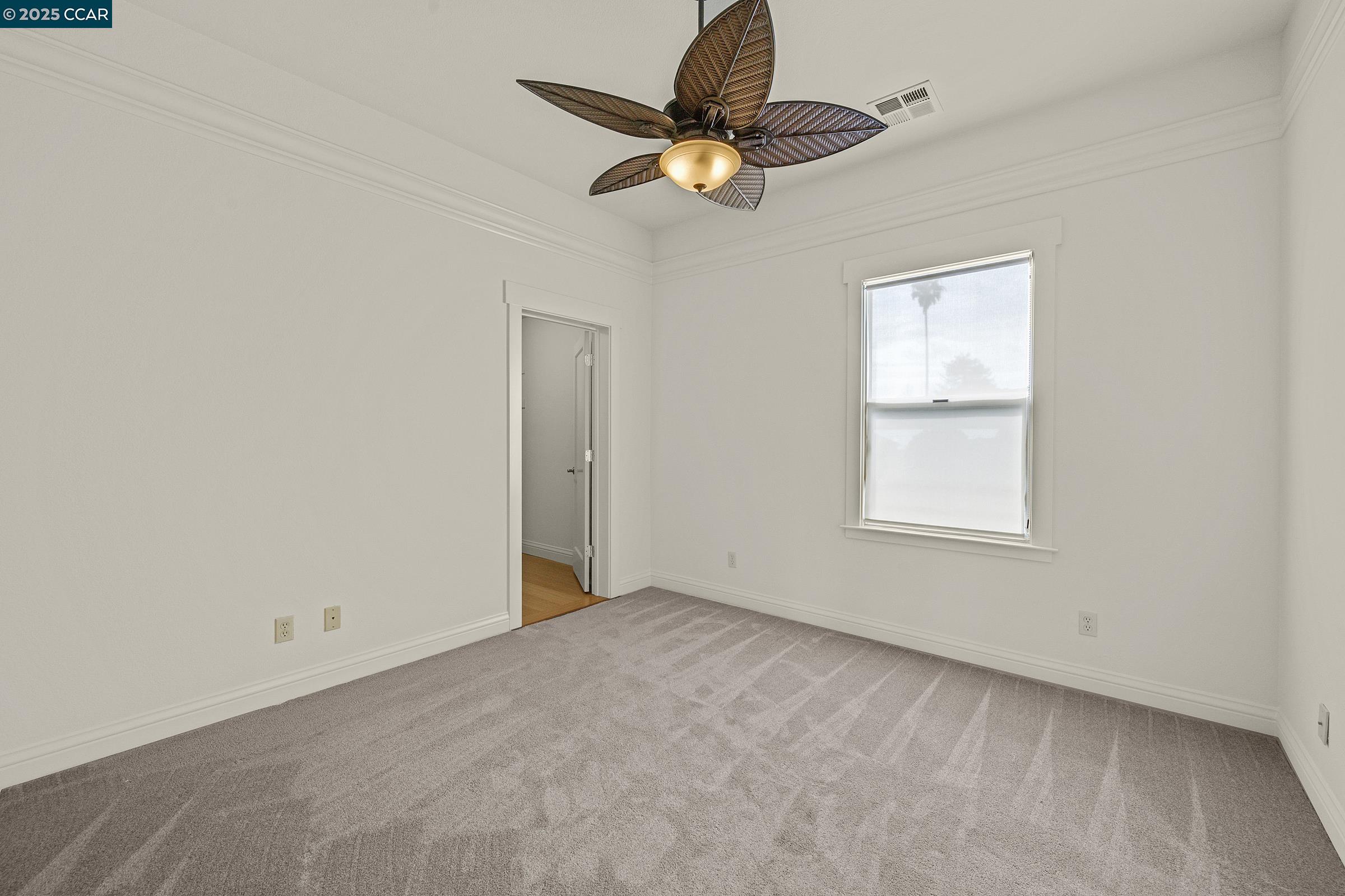 2581 Charles Avenue Pinole, CA 94564 - Photo 10 of 50 an empty room with a window and a fan