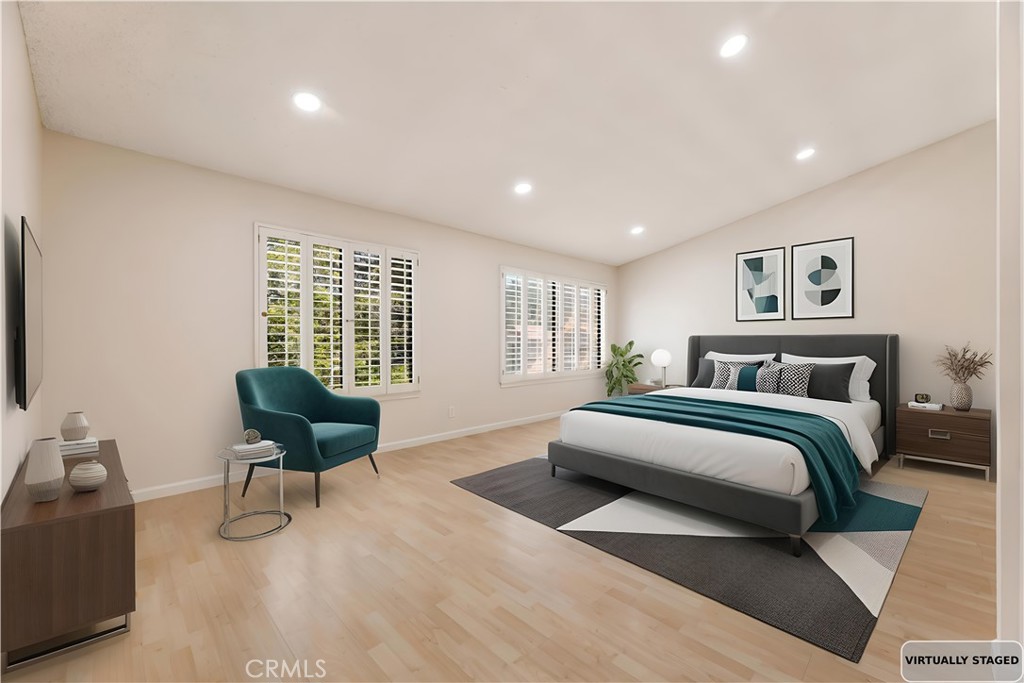 12065 Shadow Glen Lane Porter Ranch, CA 91326 - Photo 6 of 46 a spacious bedroom with a bed and chair