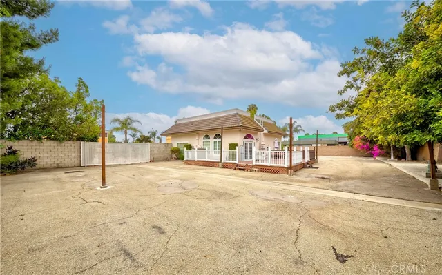a view of a house with potted plants