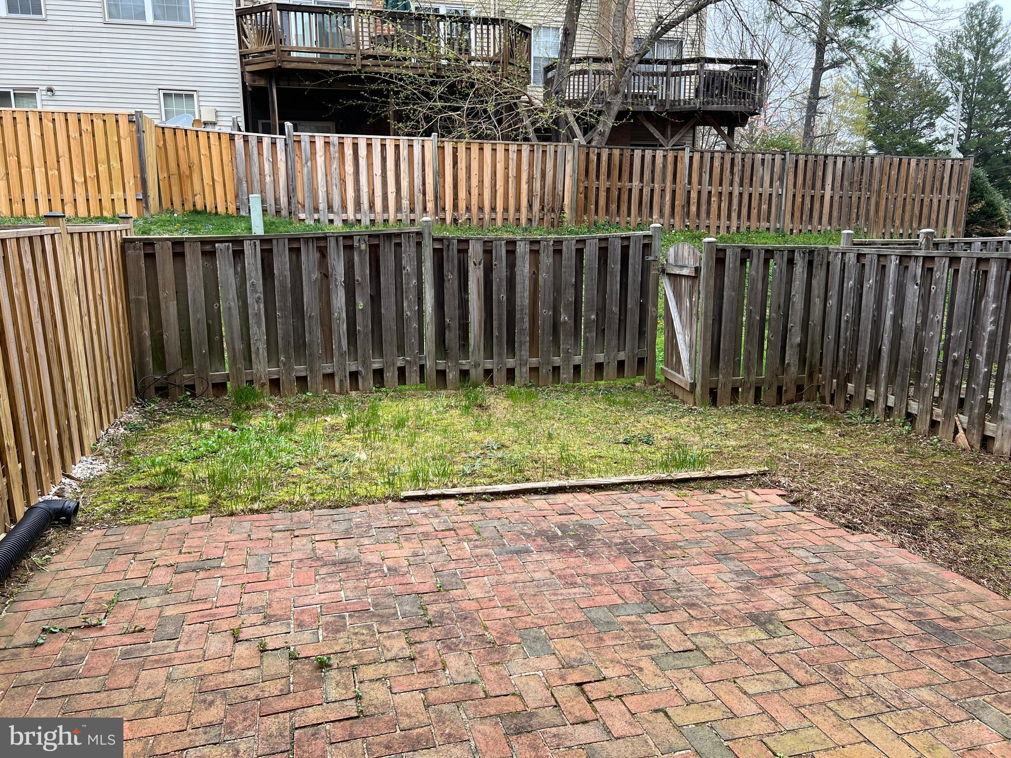 7804 Wintercress Lane Springfield, VA 22152 - Photo 47 of 64 Fenced back yard with brick patio