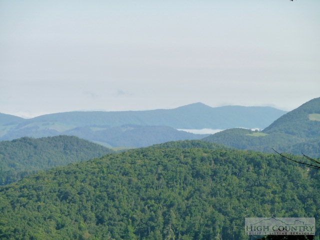 C-23 Broken Arrow Trail Boone, NC 28607 - Photo 2 of 11 a view of a mountain range with lush green forest
