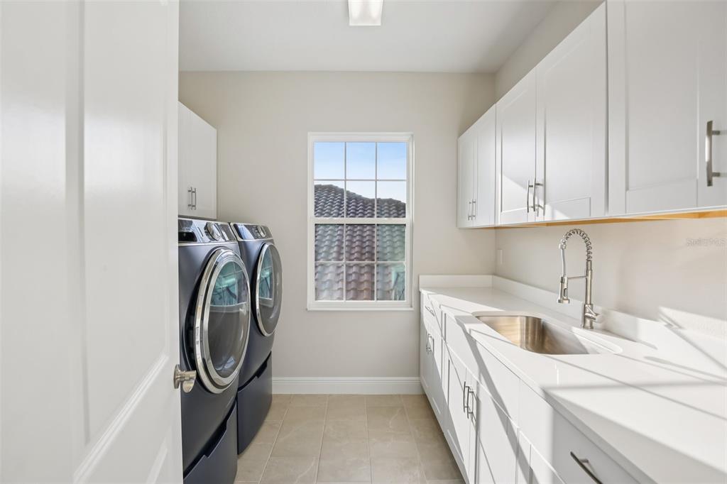 14930 Rider Pass Drive Lithia, FL 33547 - Photo 14 of 63 a utility room with a sink dryer and washer