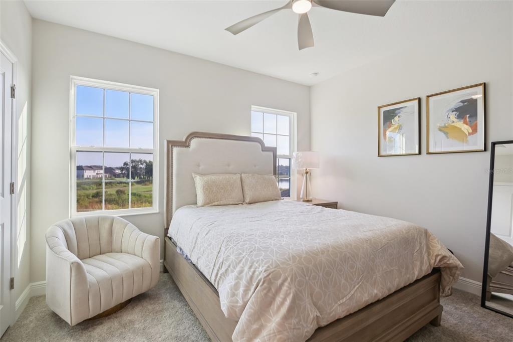 14930 Rider Pass Drive Lithia, FL 33547 - Photo 16 of 63 a bedroom with a bed and a couch