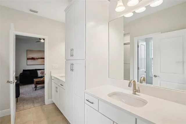 a living room with furniture a rug and a window