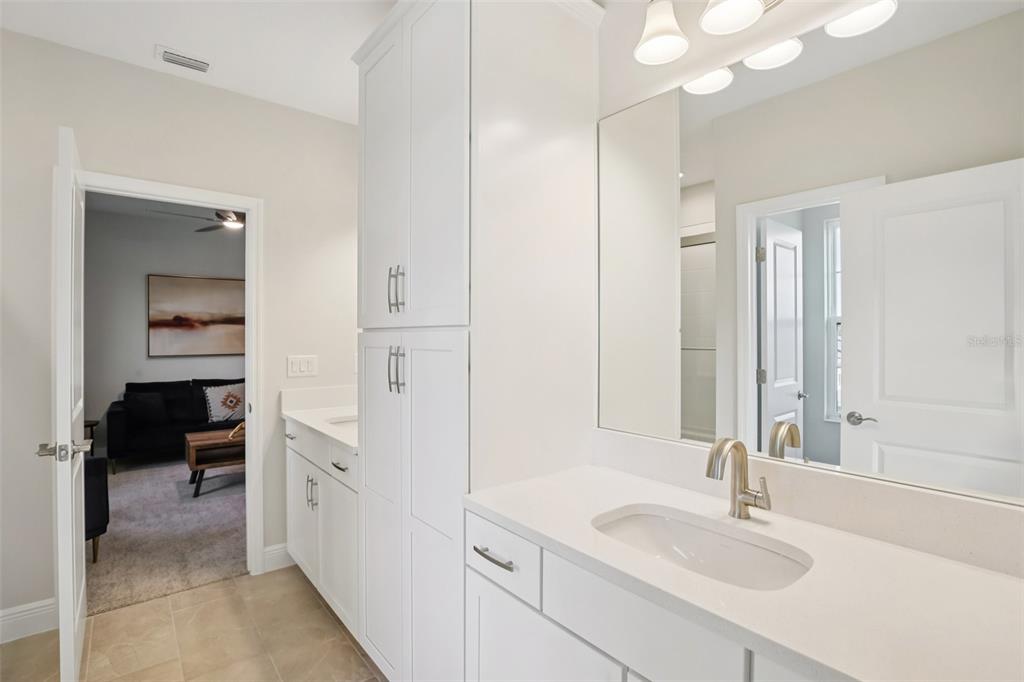 14930 Rider Pass Drive Lithia, FL 33547 - Photo 25 of 63 a en suite bathroom with a sink and a mirror