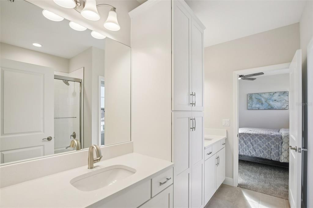 14930 Rider Pass Drive Lithia, FL 33547 - Photo 26 of 63 a en suite bathroom with a sink double vanity and a mirror