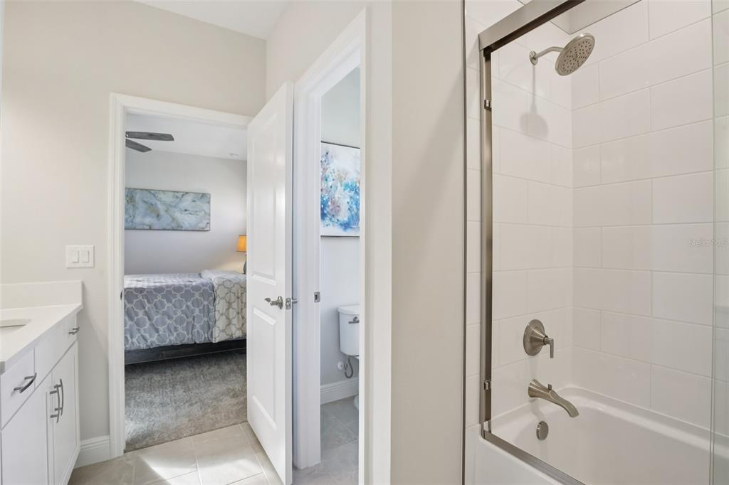 14930 Rider Pass Drive Lithia, FL 33547 - Photo 27 of 63 a bathroom with a tub shower and a sink