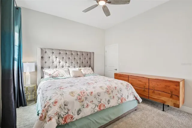 a bedroom with a large bed and a large window