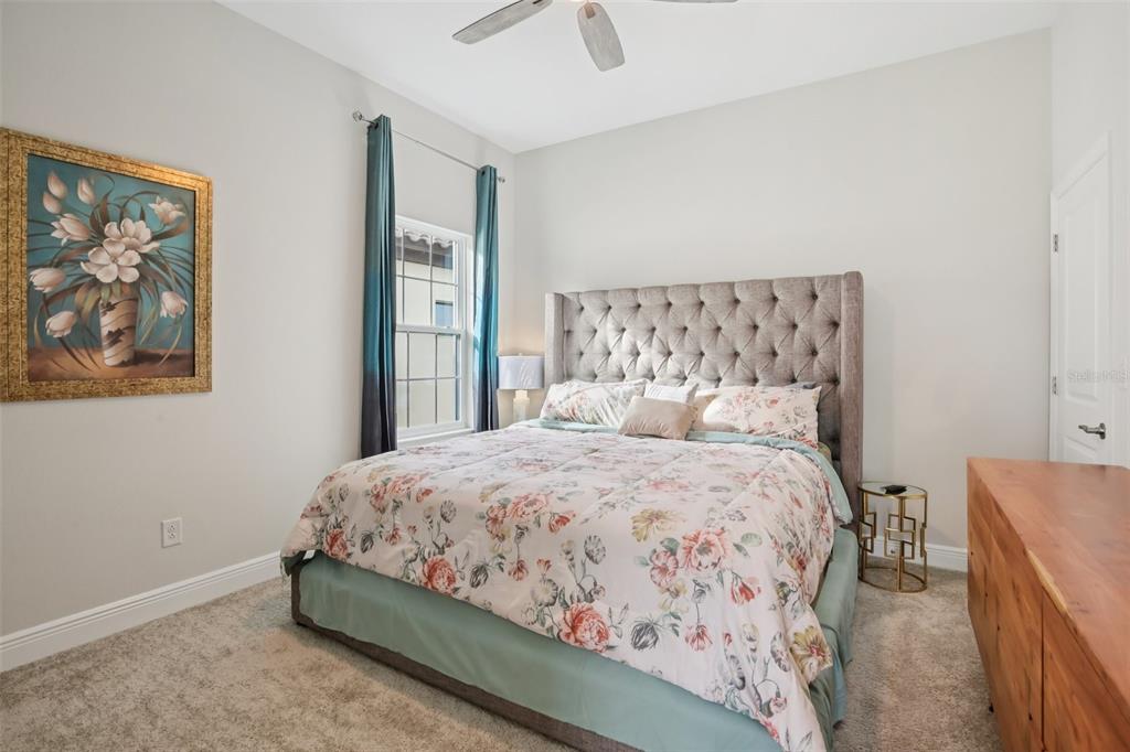 14930 Rider Pass Drive Lithia, FL 33547 - Photo 35 of 63 a bedroom with a bed and a painting on the wall