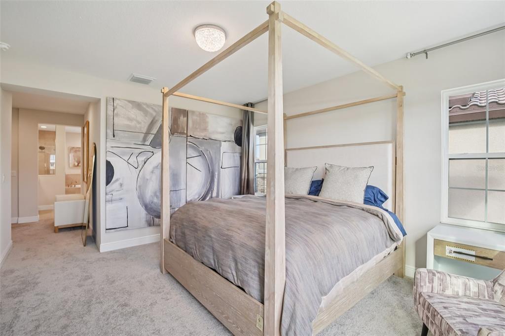 14930 Rider Pass Drive Lithia, FL 33547 - Photo 42 of 63 a bedroom with a bed and a walk in closet