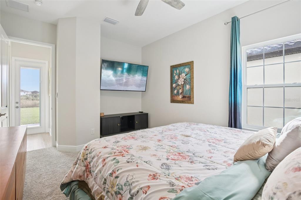14930 Rider Pass Drive Lithia, FL 33547 - Photo 45 of 63 a bedroom with a bed and a window