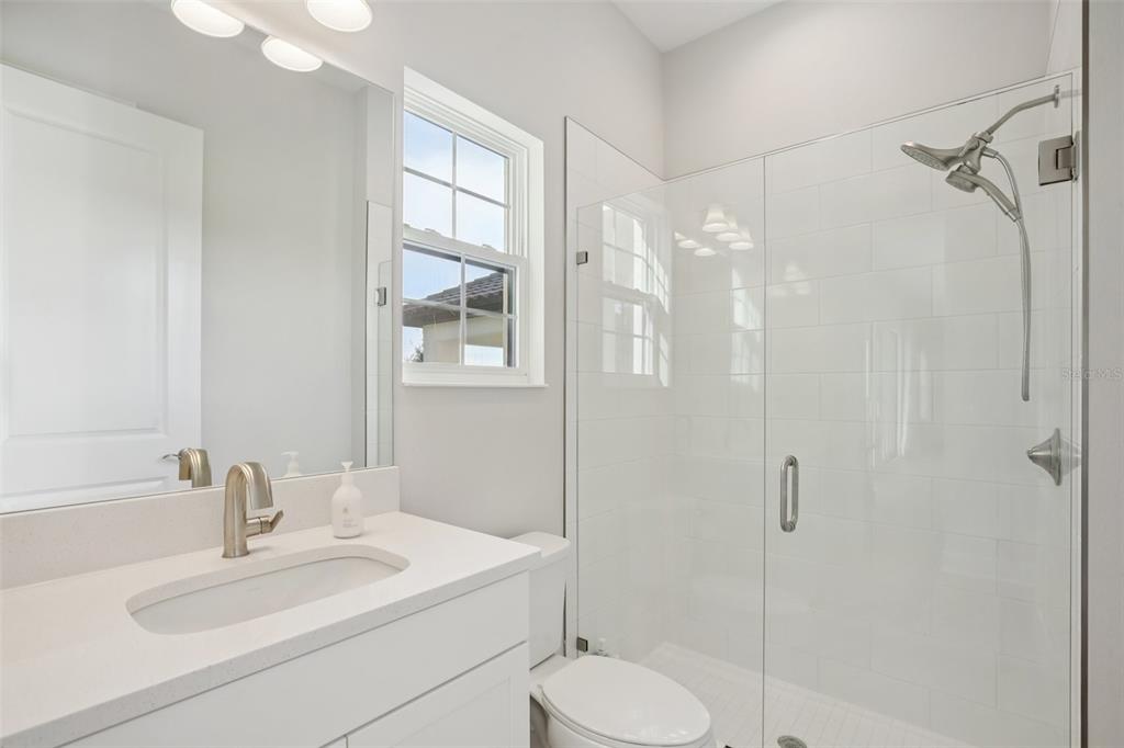 14930 Rider Pass Drive Lithia, FL 33547 - Photo 46 of 63 a bathroom with a sink toilet and shower