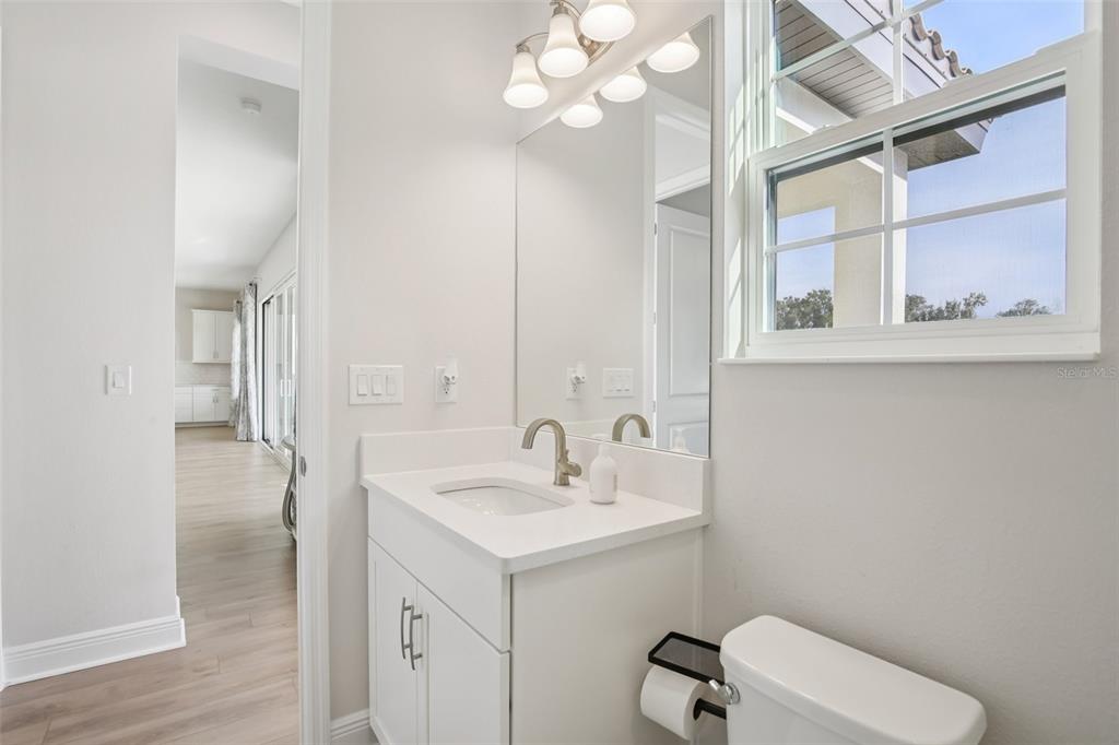 14930 Rider Pass Drive Lithia, FL 33547 - Photo 47 of 63 a bathroom with a sink a toilet and a mirror