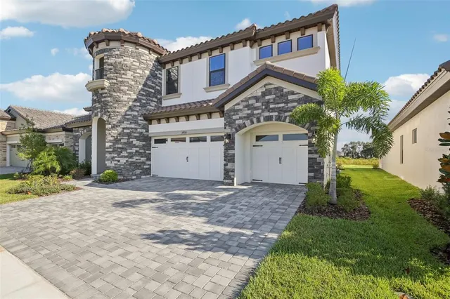 an aerial view of a house with outdoor space patio and ocean view