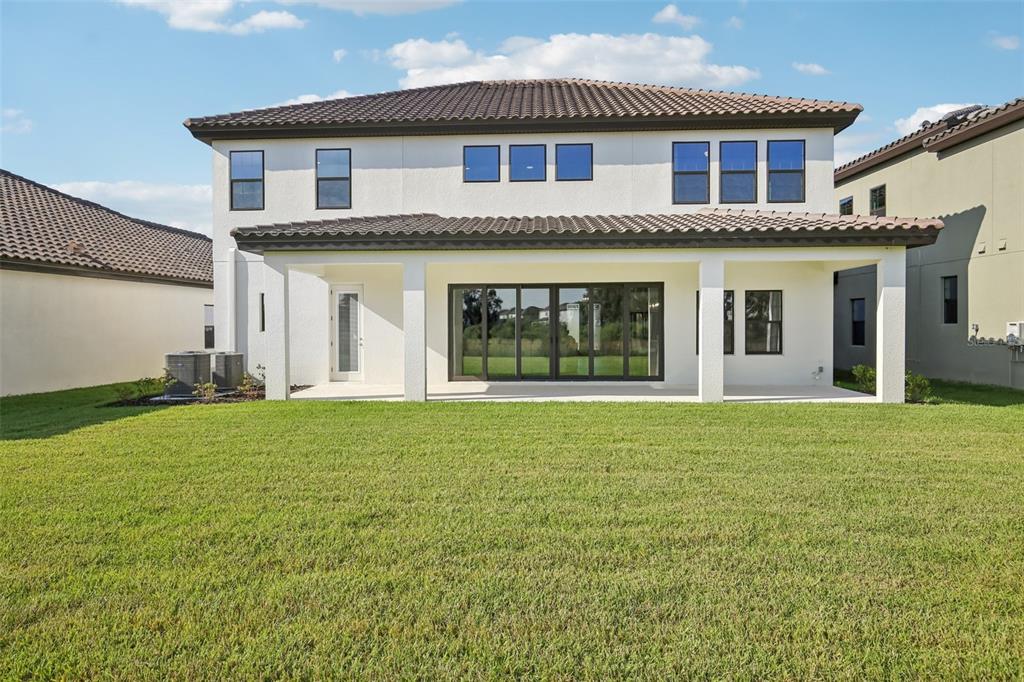 14930 Rider Pass Drive Lithia, FL 33547 - Photo 49 of 63 a front view of a house with a garden