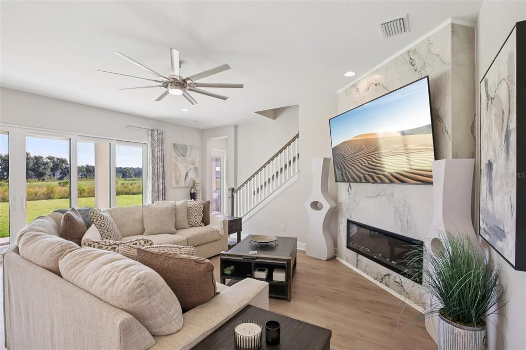 14930 Rider Pass Drive Lithia, FL 33547 - Photo 5 of 63 a living room with furniture fireplace and flat screen tv