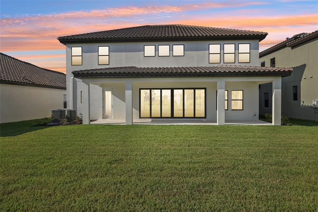 14930 Rider Pass Drive Lithia, FL 33547 - Photo 57 of 63 a front view of a house with a garden