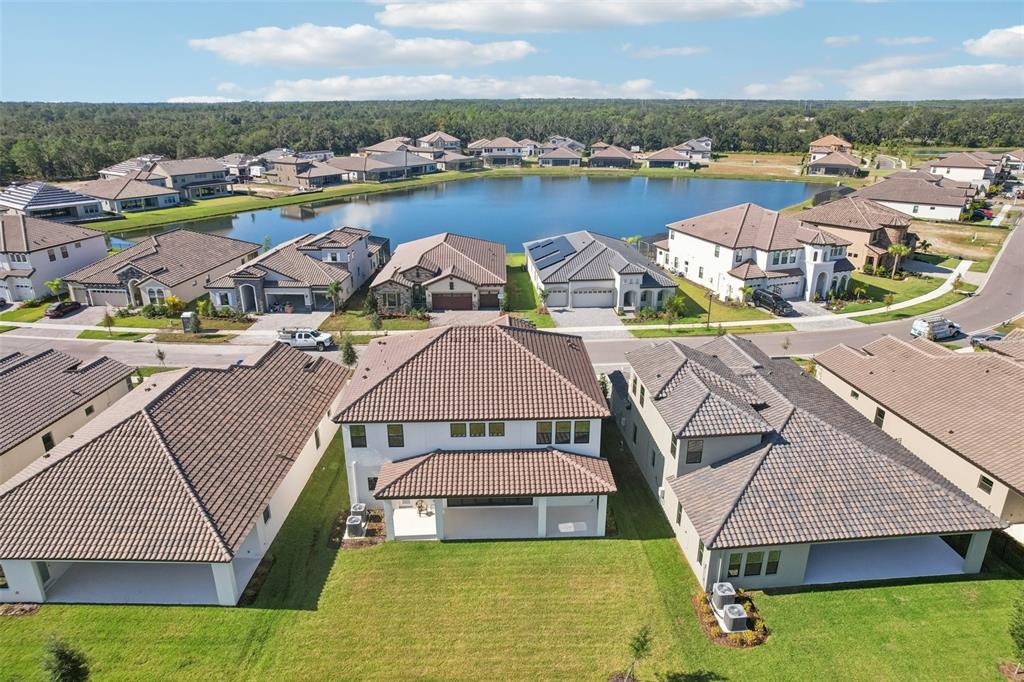 14930 Rider Pass Drive Lithia, FL 33547 - Photo 60 of 63 an aerial view of a house with swimming pool and ocean view