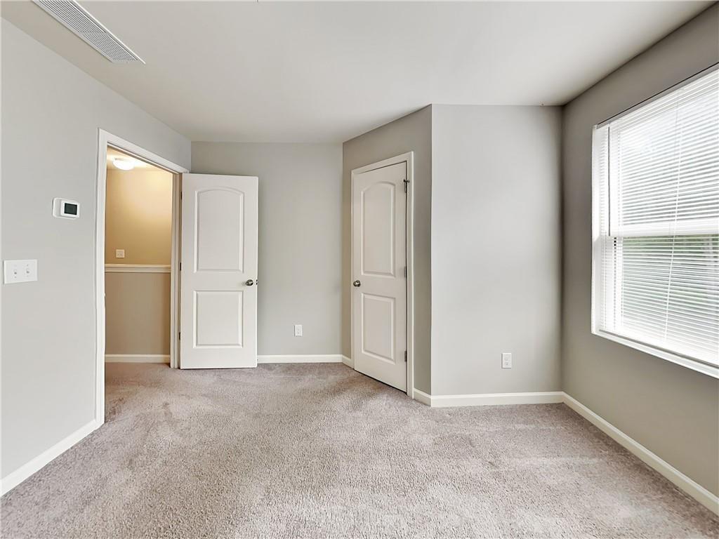 2565 Piering Drive Lithonia, GA 30038 - Photo 12 of 20 an empty room with windows and closet
