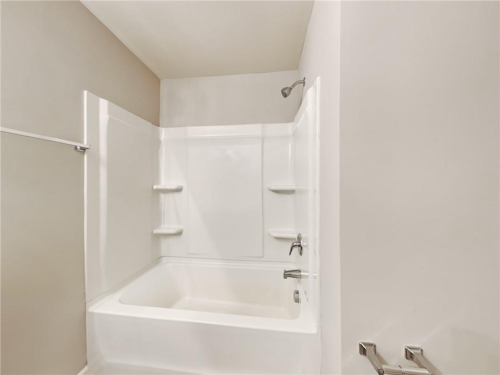 2565 Piering Drive Lithonia, GA 30038 - Photo 13 of 20 a bathroom with a bathtub