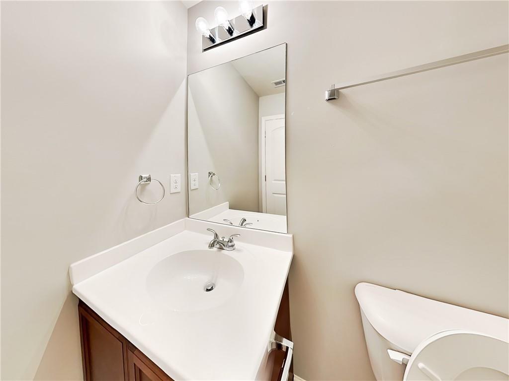 2565 Piering Drive Lithonia, GA 30038 - Photo 19 of 20 a bathroom with a sink vanity and a mirror