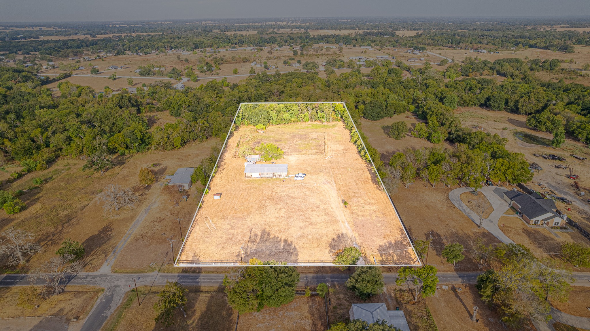 1313 Greenbriar Road Madisonville, TX 77864 - Photo 1 of 25 a view of a swimming pool with a lake view