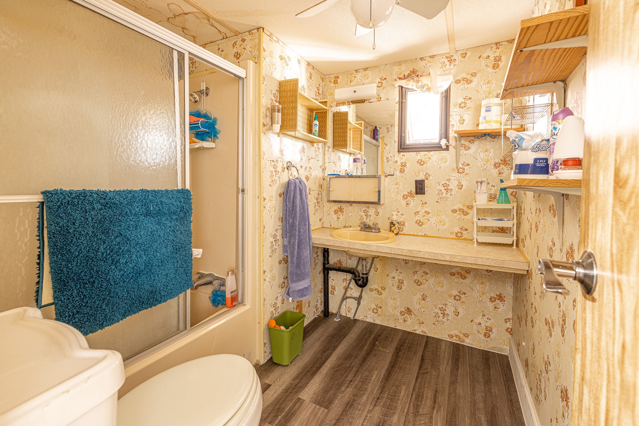 1313 Greenbriar Road Madisonville, TX 77864 - Photo 21 of 25 a bathroom with a sink a toilet and shower