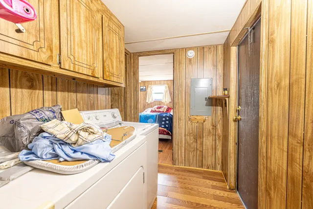 a bed room with a bed and a window