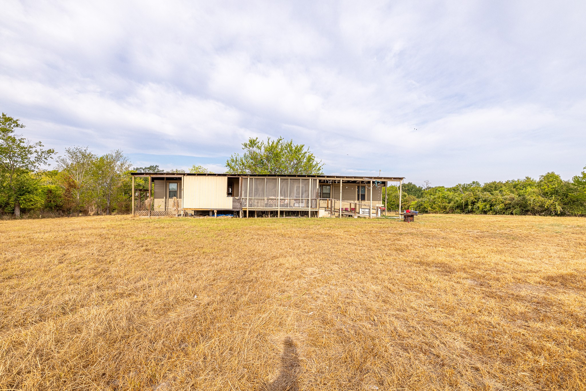 1313 Greenbriar Road Madisonville, TX 77864 - Photo 7 of 25 a view of pool of water with houses in the background
