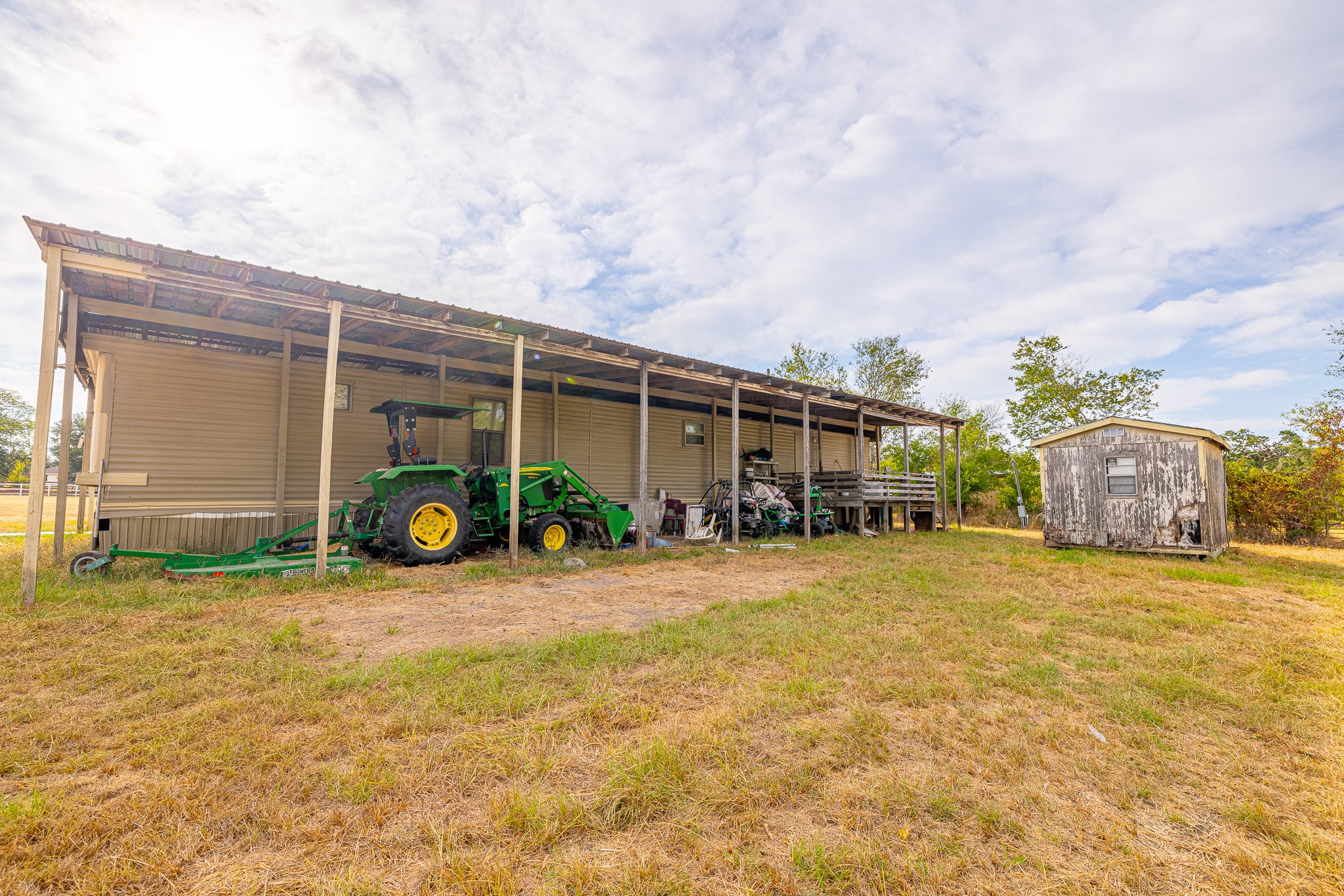 1313 Greenbriar Road Madisonville, TX 77864 - Photo 8 of 25 a view of a house with a yard and table and chairs
