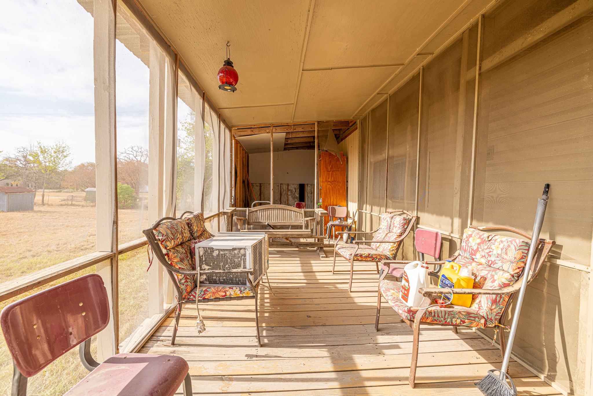 1313 Greenbriar Road Madisonville, TX 77864 - Photo 10 of 25 a view of living room with patio furniture and floor to ceiling windows