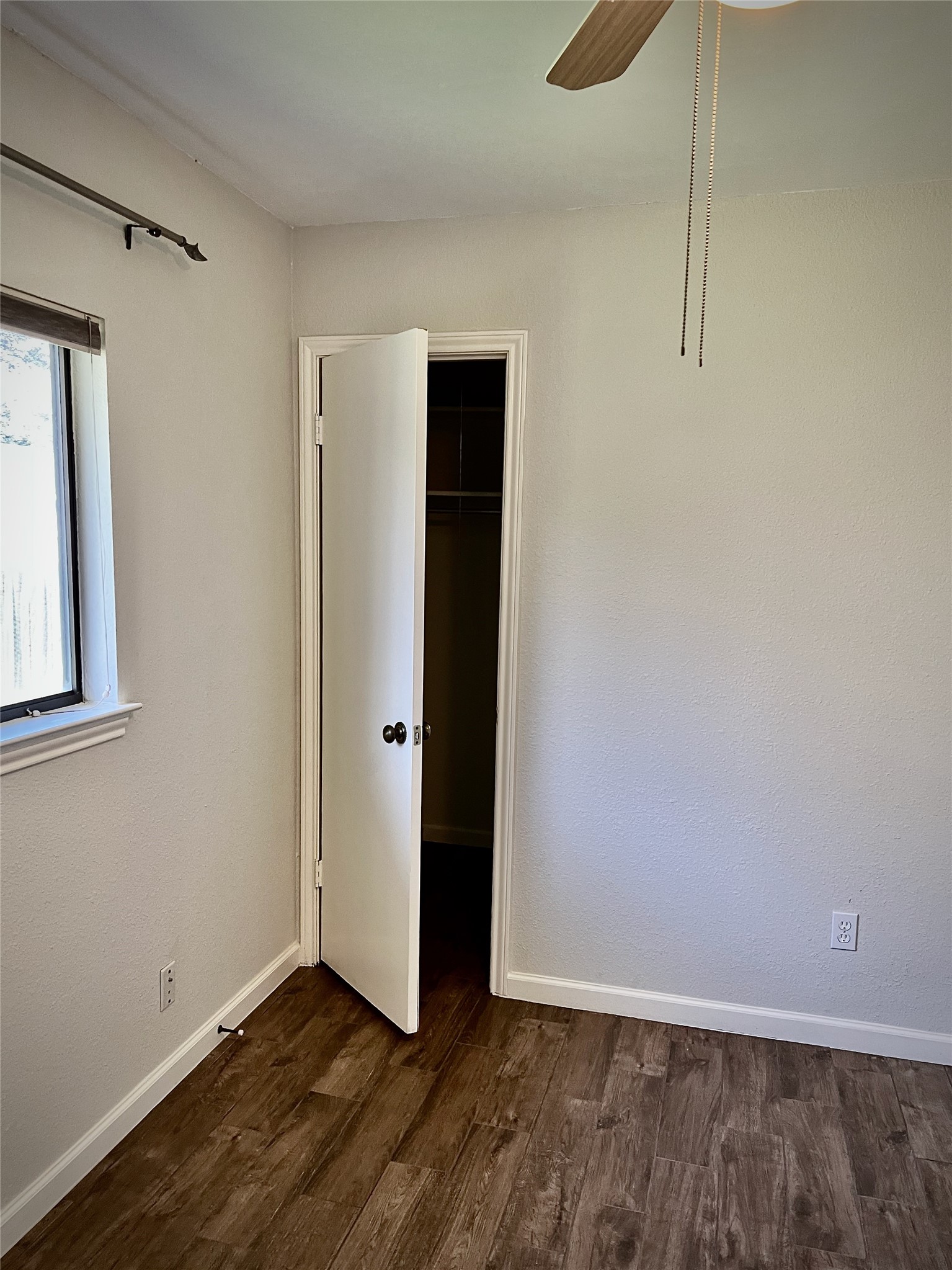 7010 Dallas Drive Austin, TX 78729 - Photo 10 of 14 a view of an empty room with closet and a window