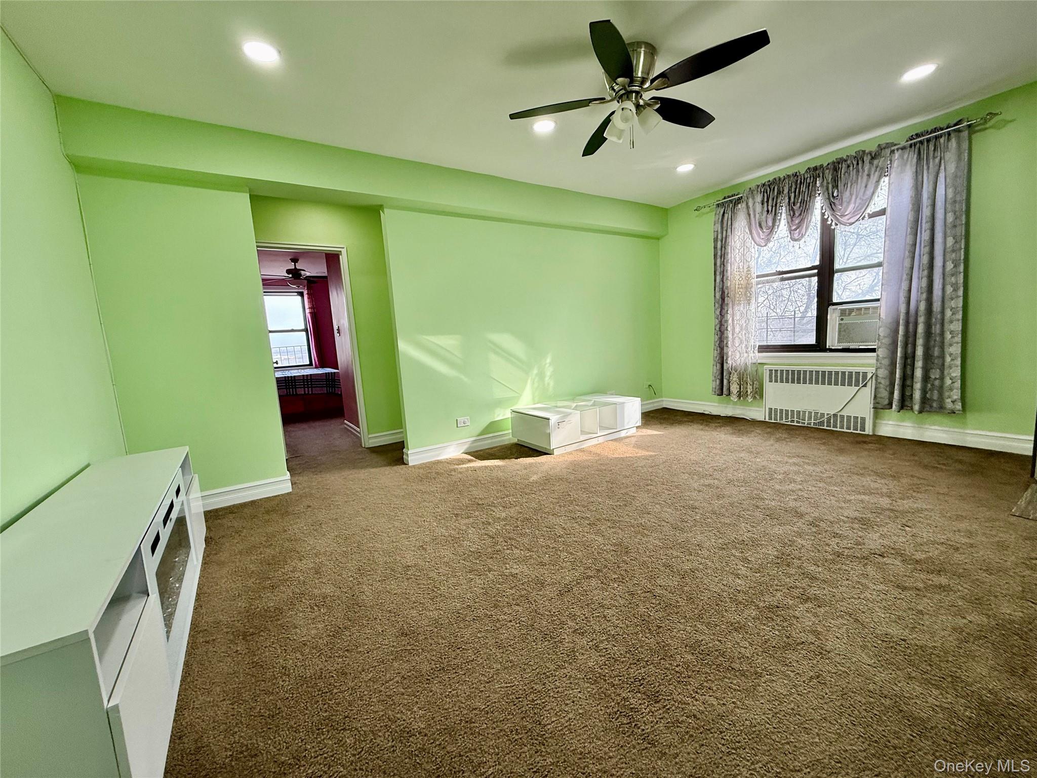 112-30 Northern Boulevard, Unit 4G Queens, NY 11368 - Photo 12 of 38 a view of livingroom with hardwood and ceiling fan