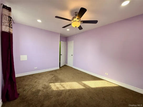 a view of a ceiling fan with wooden floor