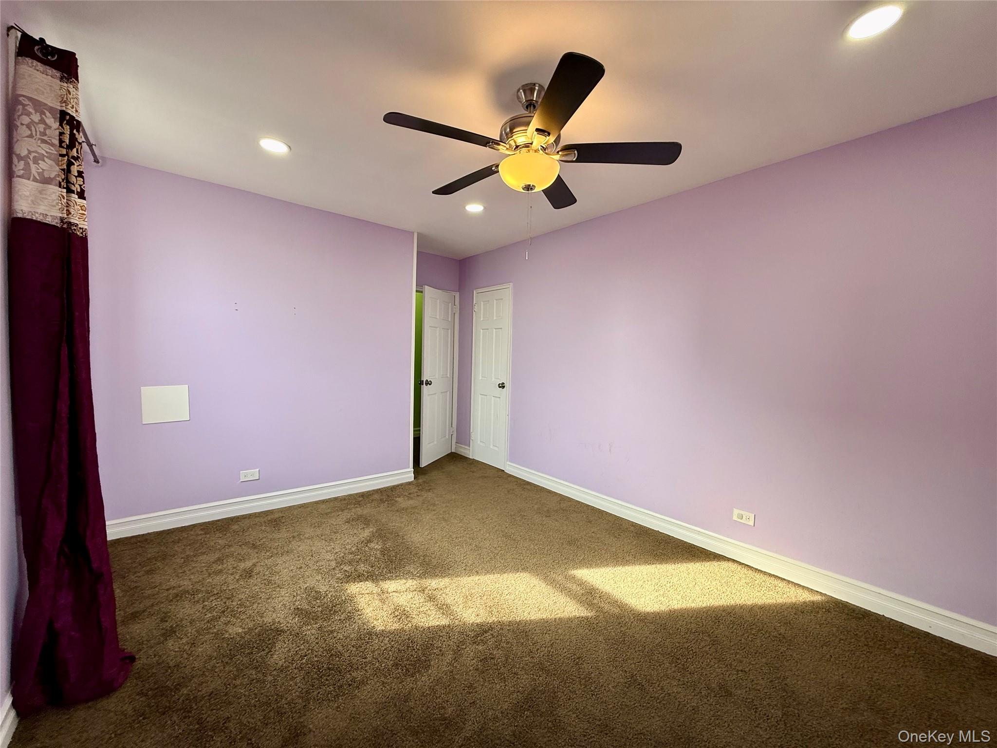 112-30 Northern Boulevard, Unit 4G Queens, NY 11368 - Photo 16 of 38 a view of a ceiling fan with wooden floor