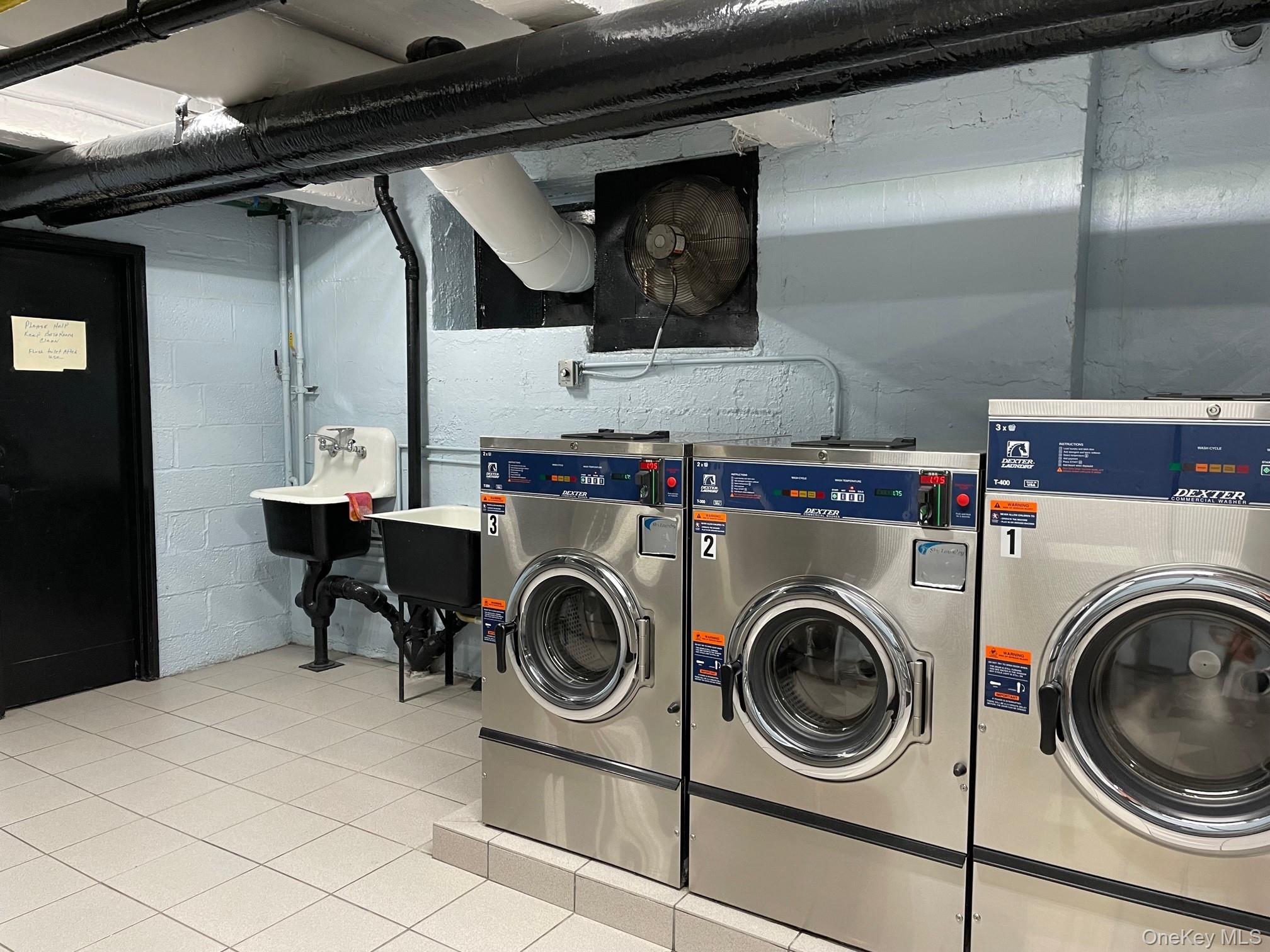112-30 Northern Boulevard, Unit 4G Queens, NY 11368 - Photo 23 of 38 a utility room with dryer and washer