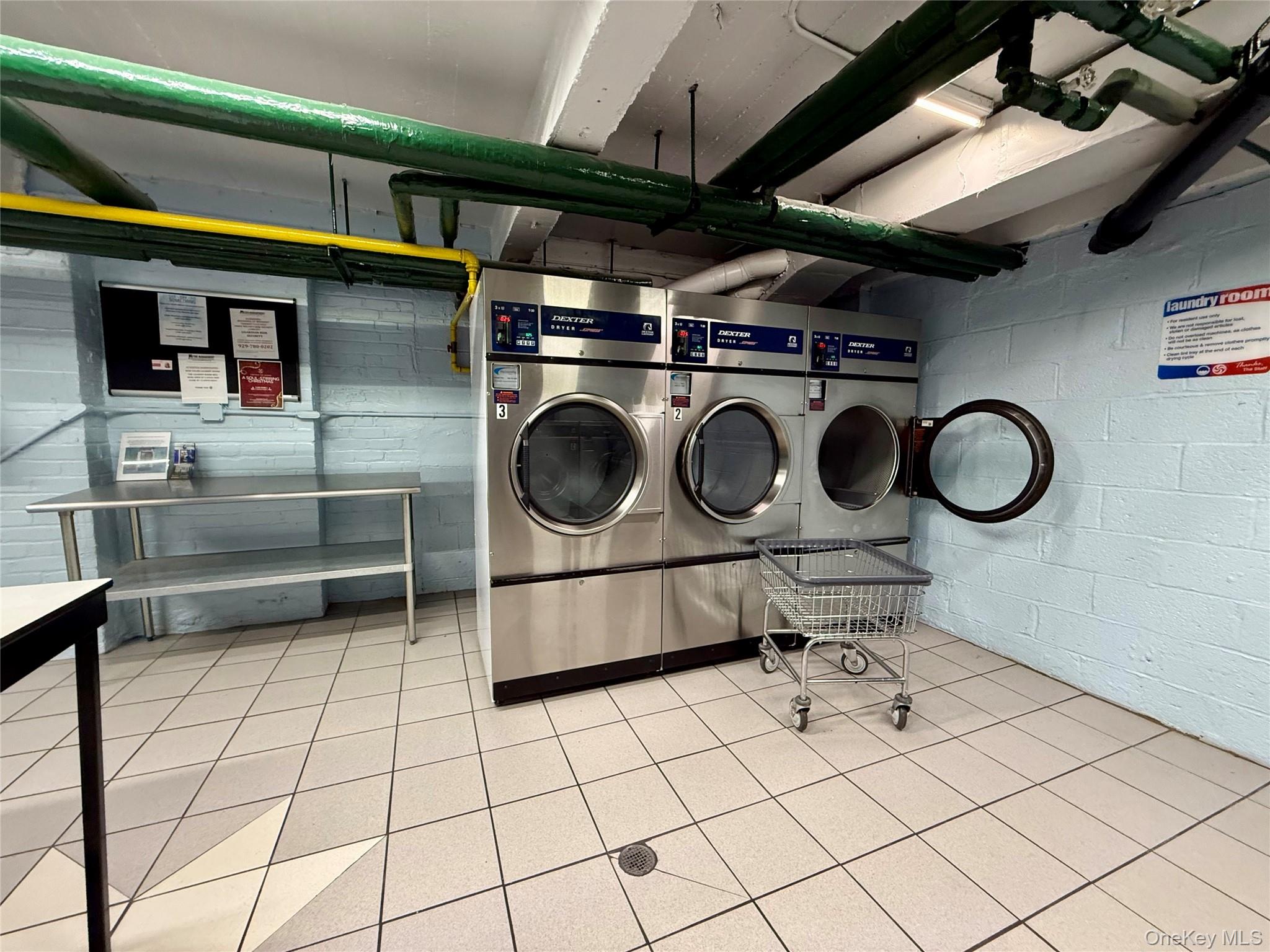 112-30 Northern Boulevard, Unit 4G Queens, NY 11368 - Photo 24 of 38 a utility room with dryer and washer