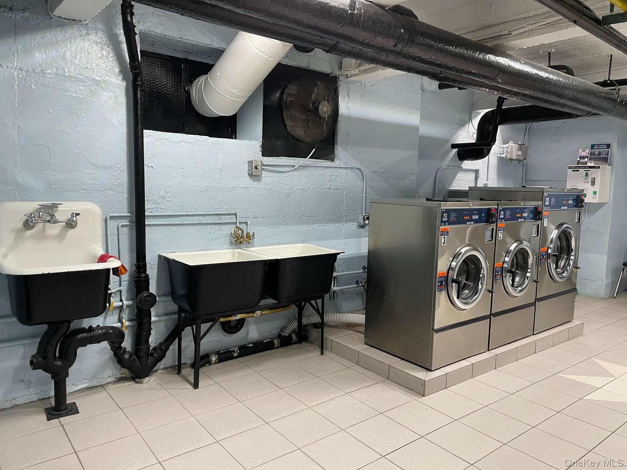 112-30 Northern Boulevard, Unit 4G Queens, NY 11368 - Photo 25 of 38 a utility room with dryer and washer