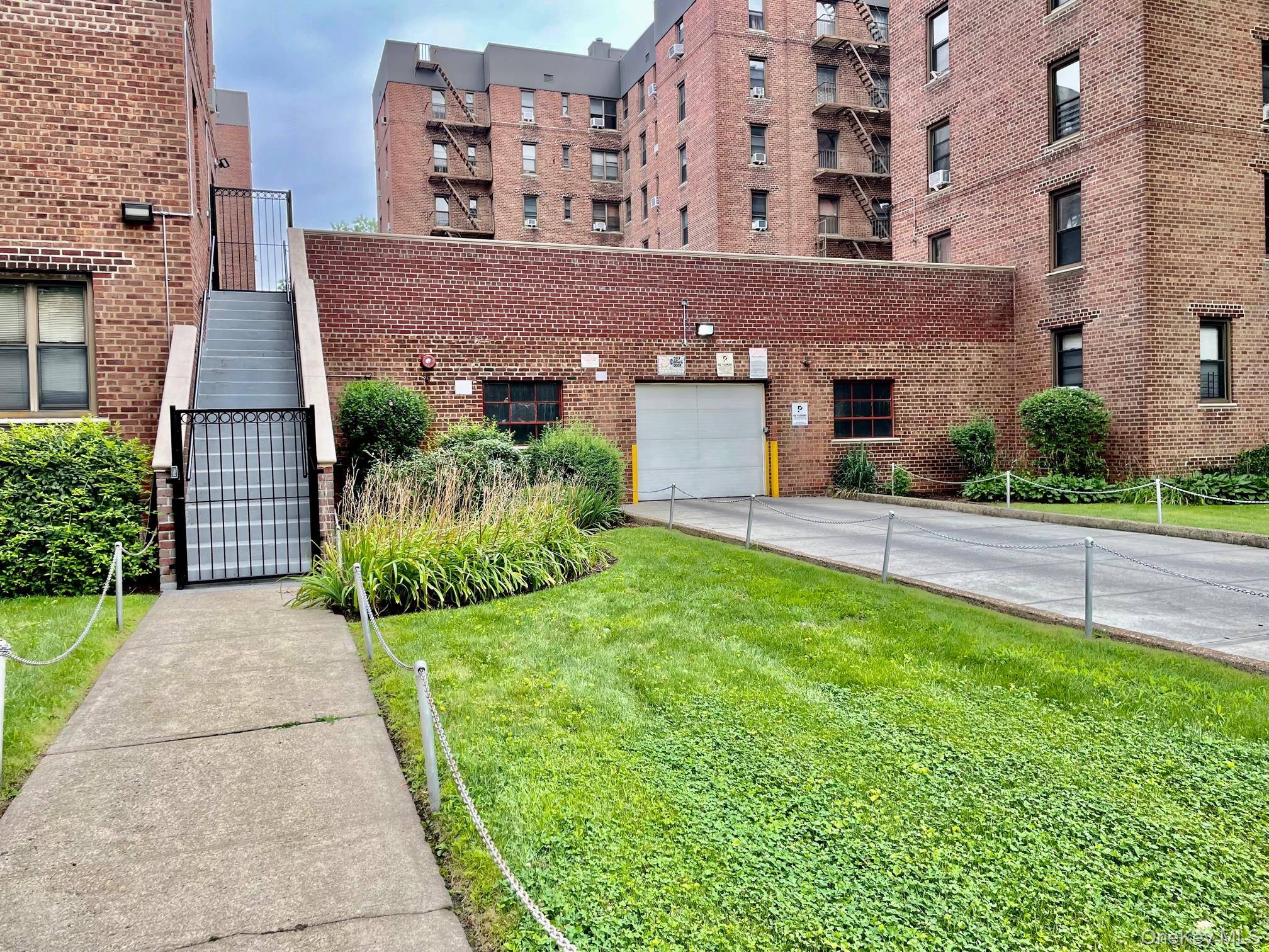 112-30 Northern Boulevard, Unit 4G Queens, NY 11368 - Photo 28 of 38 a view of a building with a yard