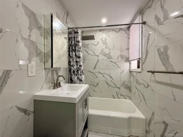 a bathroom with a sink and a bathtub