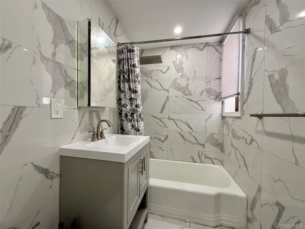 a bathroom with a sink and a bathtub